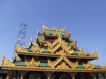 Low angle view of temple against clear blue sky