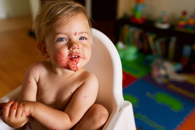 Portrait of cute baby girl at home