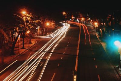 Light trails on road in city at night