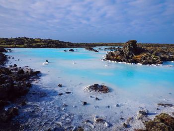 Scenic view of sea against cloudy sky