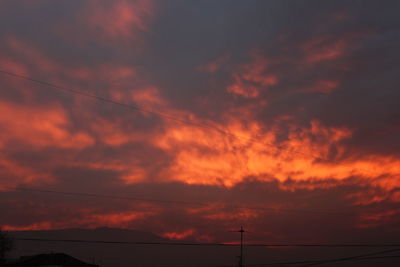 Low angle view of dramatic sky during sunset