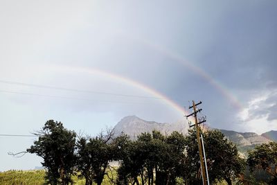 Low angle view of rainbow against sky