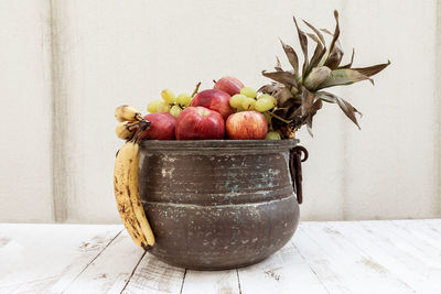 Close-up of fruits in container on table