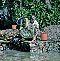 Portrait of woman sitting in water