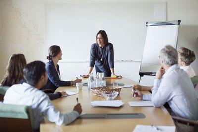 Group of business people discussing in board room
