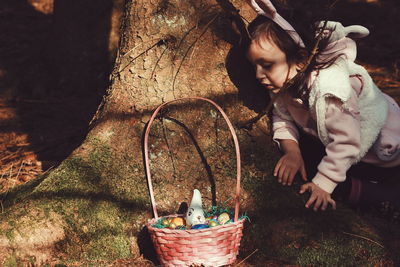 Full length of young woman in basket