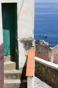 Steps by sea against sky