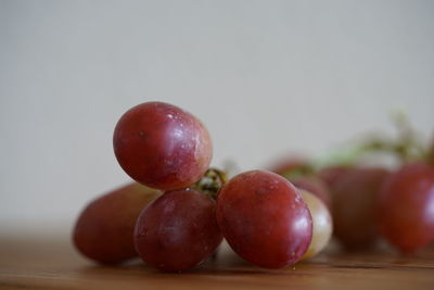 Close-up of grapes on table