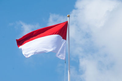 Low angle view of flag against sky