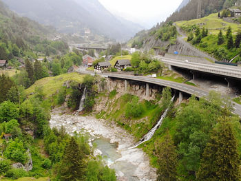 High angle view of bridge over river against mountains