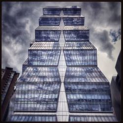 Low angle view of building against cloudy sky