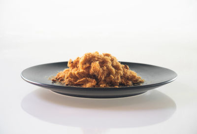 Close-up of bread in plate on table