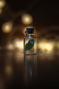 Close-up of glass bottle on table