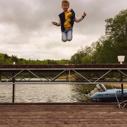 Full length of woman standing against sky