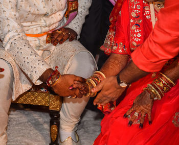 Midsection of women in traditional clothing