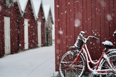 Bicycle on snow covered city