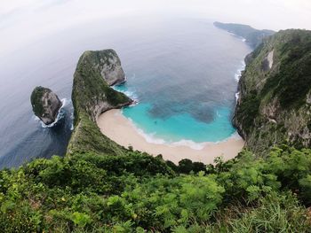 High angle view of trees by sea against sky