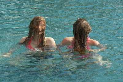 Girls swimming in pool