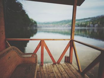 Pier over lake against sky