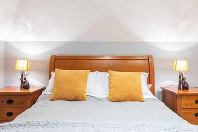 View of electric lamp on bed at home