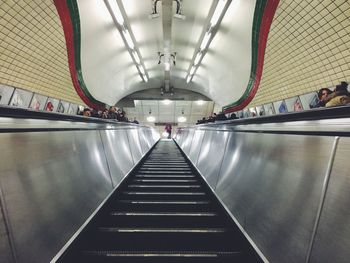 Low angle view of illuminated escalator