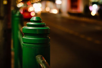 Close-up of illuminated lighting equipment on street