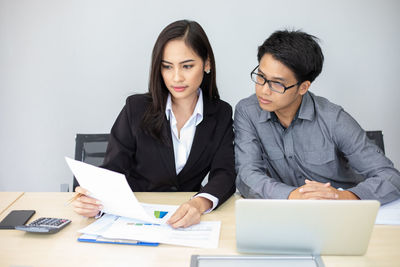 Colleagues working at office