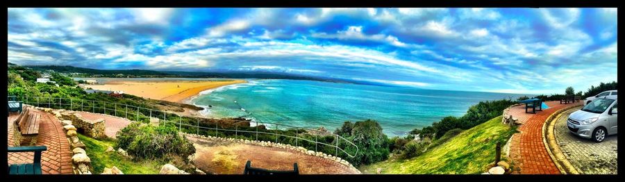 Scenic view of sea against cloudy sky