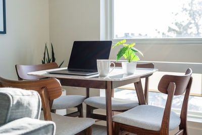 Empty chairs and table at home