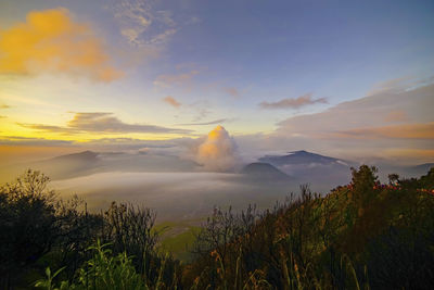 Scenic view of landscape against sky during sunset