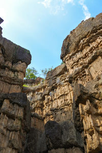 Low angle view of old ruins against sky