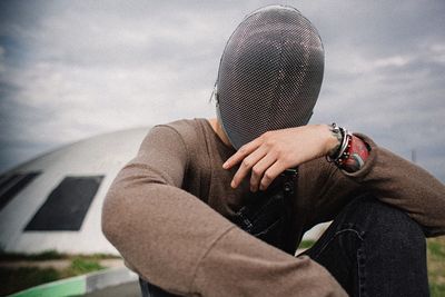 Close-up of woman standing against sky