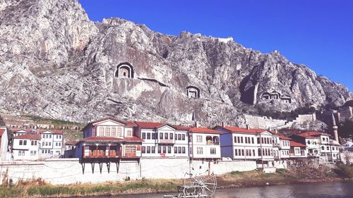 Houses against rock formation