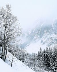 Scenic view of snow covered landscape against clear sky