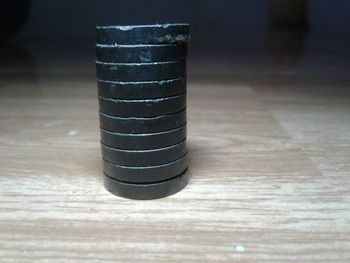 Close-up of stack on wooden table