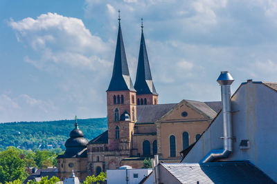 Buildings in city against sky