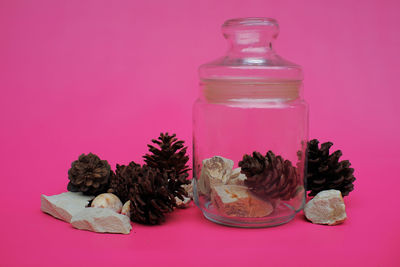 Close-up of bottles against yellow background