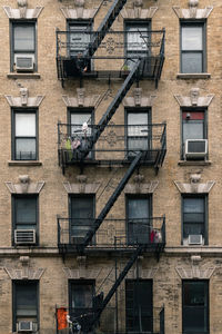 Low angle view of liwer eastside manhattan residential building with iron fire escape 