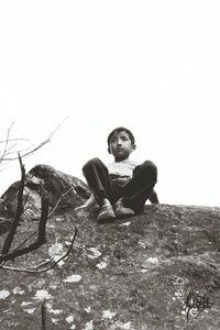 Portrait of boy holding umbrella