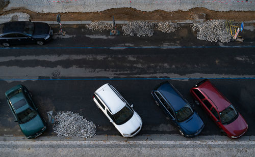 High angle view of damaged car on street against wall