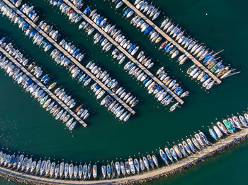 High angle view of pier amidst sea and buildings