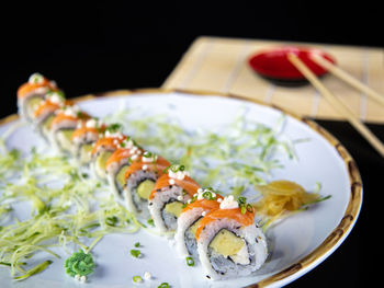 Close-up of sushi served on table
