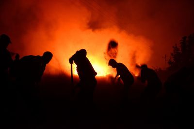 Silhouette of people at night