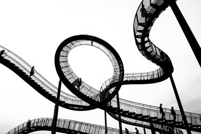 Low angle view of ferris wheel against sky