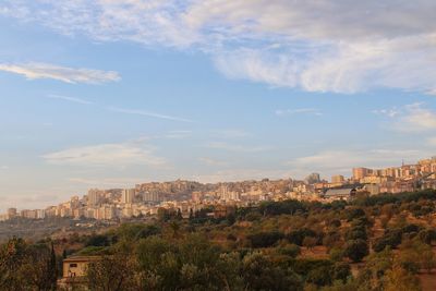 Buildings in city against sky