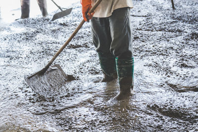 Low section of man working on water