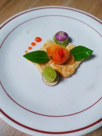 High angle view of fruits in plate on table