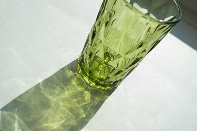 High angle view of green glass on table