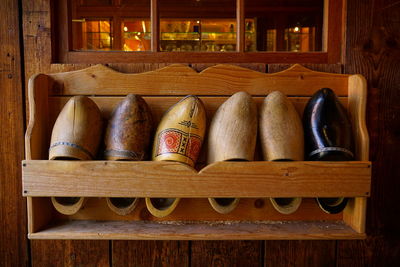 Wooden shoes on shelf