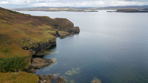 High angle view of rocks on sea against sky